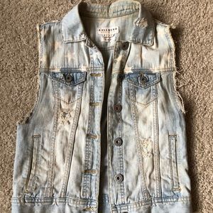 Distressed denim vest